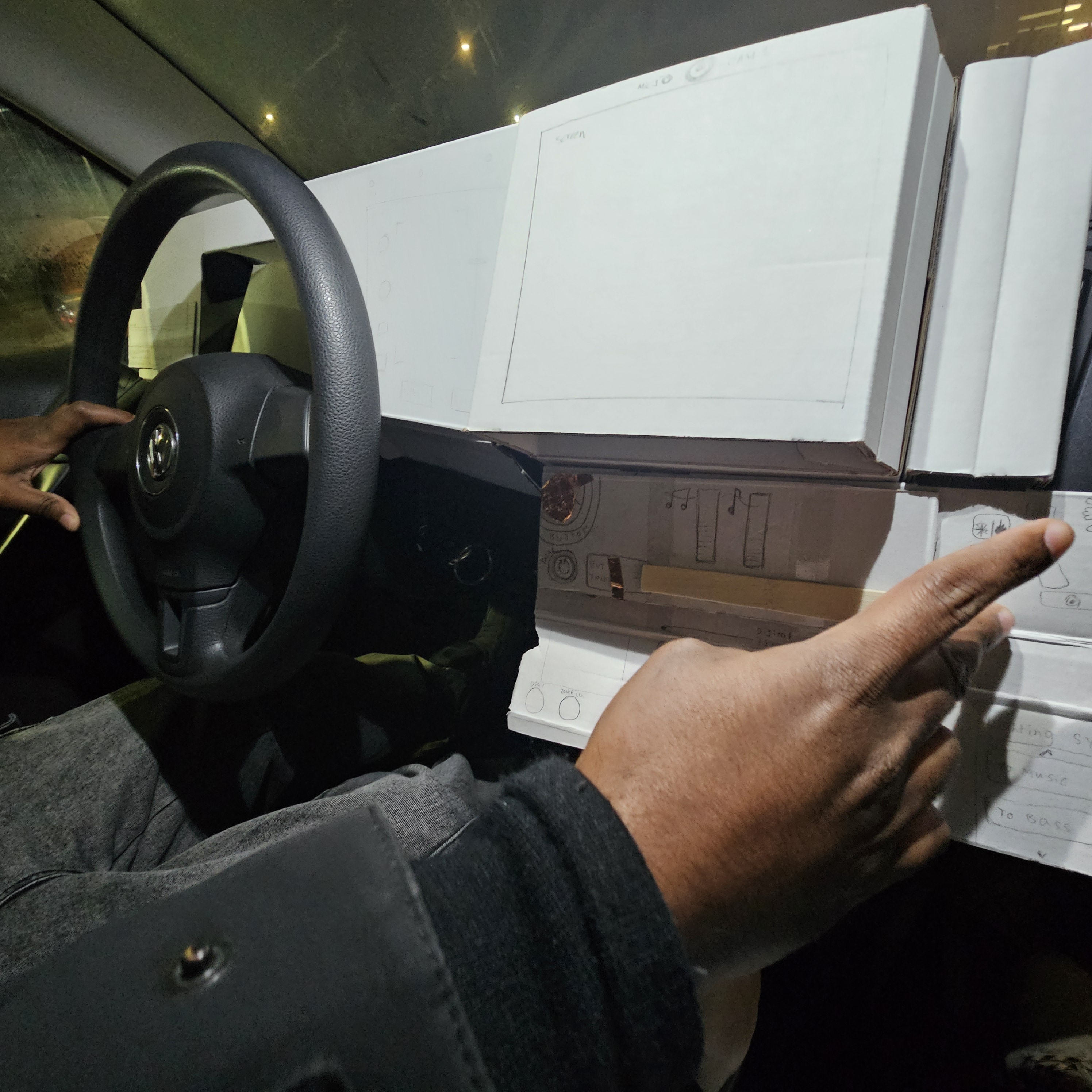 Testing physical interface of how one driver would interact with the proposed dash console. Vertical physical screen interactions or gesture interactions were deemed to be less cognitively distracting compared to horizontal content. This helped determine what type of content can be positioned within the cockpit. The type of content relates to the feature the driver would want to use while driving versus when parked. This also helped determine what type of physical computing components (possible sensor or the feature) would be necessary to build the dash console prototype.